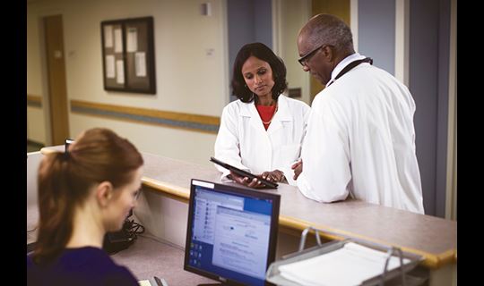 Doctors examining notes